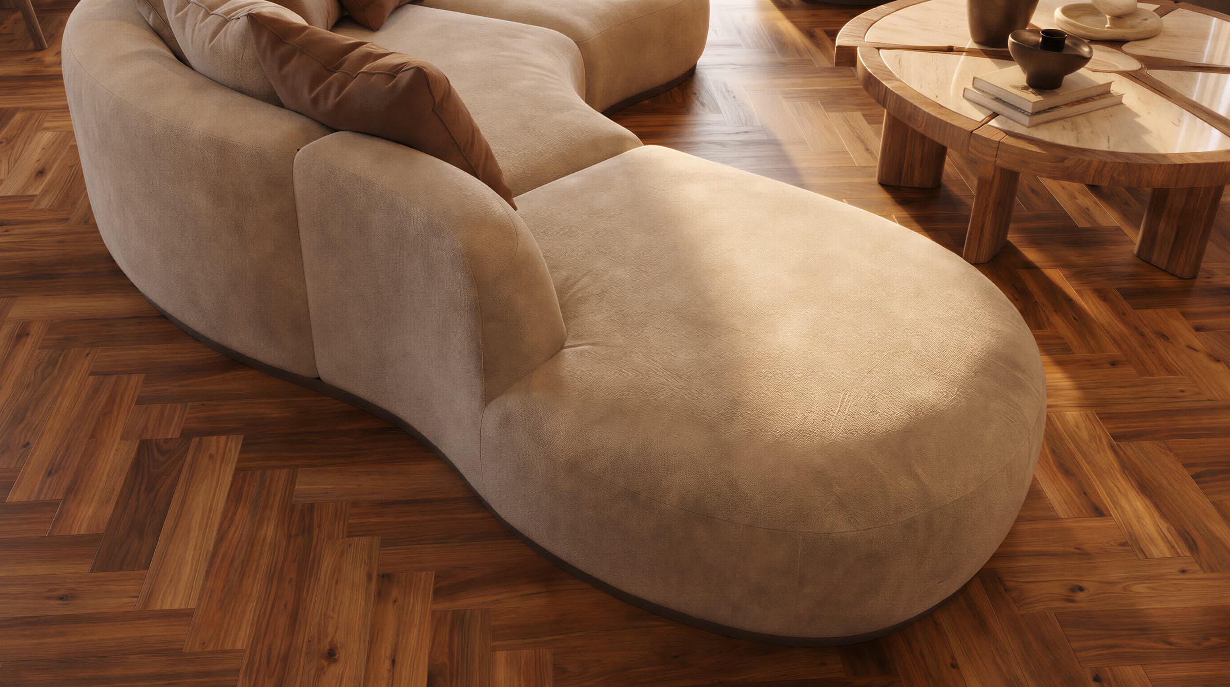 Detalle del sofá curvo y la mesa de centro